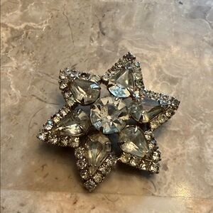 Large vintage 1950s Silvertone and rhinestone star brooch with clear crystal